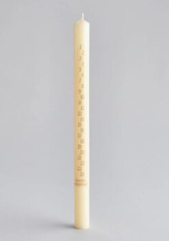 Ivory coloured advent candle with the numbers 1 to 24 down the candle. Text at the bottom reads Happy Christmas.