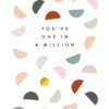 White card with the text 'You're one in a million' on the front. The design features one gold foil spot amongst lots of different coloured semi-circles.