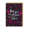Black card with brown envelope. The text on the front reads You are my moon and stars and the card is decorated with neon pink and white moons, stars and planets.
