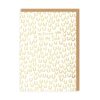 White card covered in a pattern of gold horseshoes. The text 'Wishing you all the luck' is in the centre in gold text.