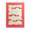 Engagement card with a repeating image of two sausage dogs standing nose to nose with love hearts above them. Behind the image is a clear window through which you can see heart shaped confetti which moves when you shake the card. Text on the front reads "