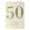 White card with a large silver 50 on the front. Text below the number reads 'fifty' in silver script.
