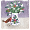 Illustration of a vase of snowdrops, festive foliage and colourful berries. A robin red breast sits next to the vase.
