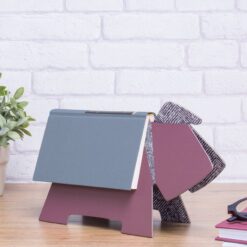Purple coloured Doggy Book Rest with a book resting over the top.