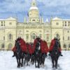 The Kings Guards on horseback outside Buckingham Palace as the snow falls.