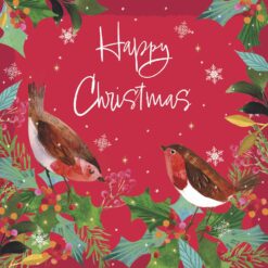 Two robins perched on sprigs of holly against a red background decorated with snowflakes. The text reads Happy Christmas.