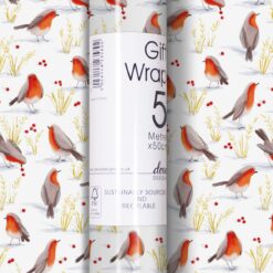 5 metre x 50cm gift wrap roll. A beautiful pattern of robin red breasts red berries and festive foliage poking through the snow. White background.