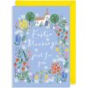 Blue card with spring flowers, trees and a church. Text reads Easter Blessings just for you.