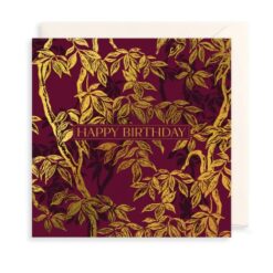 Maroon card with gold tree design and the text Happy Birthday in the centre in uppercase letters.