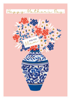 Pink Mother's Day card with text reading Happy Mother's Day along the top. An illustration of a vase of flowers in red, blue and white with a tag reading 