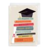 Graduation card with an illustration of a pile of books with a mortarboard at the top. The text, from top to bottom, reads The graduate, Congratulations, what a star, clever clogs, well done, genius, the sky's the limit.