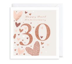 Pearl anniversary card. A large pink 30 appears in the centre with the text Happy Pearl Anniversary at the top. The card is decorated with pink, white and red hearts.