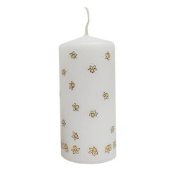 White Easter pillar candle decorated with daffodils.
