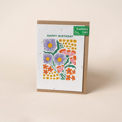 Plantable birthday card with bright, colourful flowers in a rectangular display with the text Happy Birthday at the top.