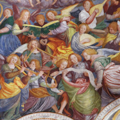 Christmas card featuring a host of angels playing instruments and singing.