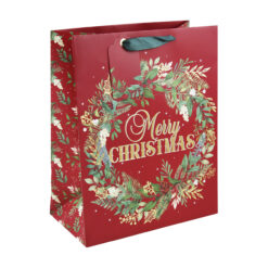 Large red Christmas gift bag with wreath design and the text Merry Christmas. The bag has green handles and a red gift tag.