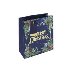Dark blue gift bag with festive foliage design and the text Merry Christmas in embossed gold. Blue ribbon handles and a gift tag are attached.