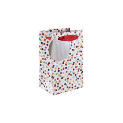 Medium white gift bag decorated with colourful spots. Red handles and a circular, silver gift tag attached.