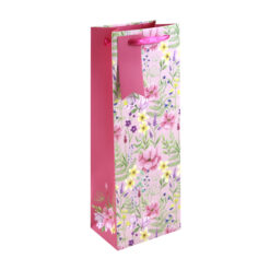 Pink bottle bag with colourful floral pattern. Pink handle and gift tag.