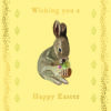 Easter card featuring an illustration of a brown rabbit holding a wicker basket which is full of colourful spring flowers. Text on the front reads 'Wishing you a Happy Easter'.