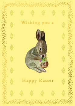 Easter card featuring an illustration of a brown rabbit holding a wicker basket which is full of colourful spring flowers. Text on the front reads 'Wishing you a Happy Easter'.