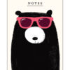 A6 notebook with an illustration of a black bear with a white nose, wearing red sunglasses. Text at the top reads 'Notes'.