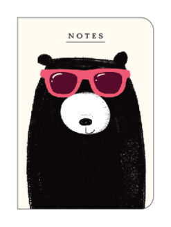 A6 notebook with an illustration of a black bear with a white nose, wearing red sunglasses. Text at the top reads 'Notes'.