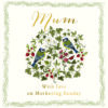 White card with the text 'Mum, with love on Mothering Sunday'. In the centre is an illustration of two birds in amongst flowers and leaves.
