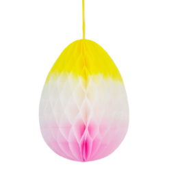 Ombre honeycomb egg painted yellow, white and pink with a yellow hanging string