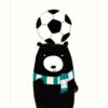Greeting card featuring a black bear wearing a blue and white striped scarf and balancing a football on its head.