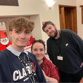 Photo of volunteers and staff at Cards for Good Causes pop up Christmas shop in Bristol.