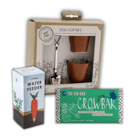 A selection of gardening gifts including a novelty carrot water feeder, Gardeners egg cup and spoon set and a Gin Growbar.