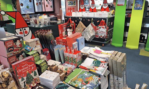 Photograph of a pop up Christmas shop in a local library.