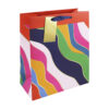 Large gift bag with a bright colourful wave design. The bag has blue handles and a rectangular gift tag attached.
