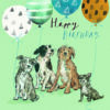 Birthday card with pale green background and an illustration of four dogs each holding a balloon. Text on the card reads 'Happy Birthday'.