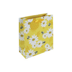Yellow medium sized gift bag with white and yellow daisies and little bees. The bag has yellow handles and a round yellow gift tag with white dots.