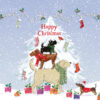 Christmas card with an image of three dogs standing on each others backs in front of a white snowy Christmas tree