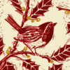 Christmas card with a lino cut printed image of a robin in a holly bush