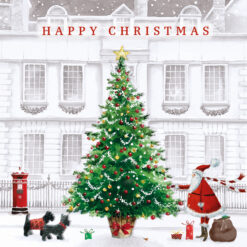 Christmas tree with an image of Santa and two scotty dogs with a large decorated Christmas tree in front of a grand building