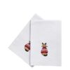 Two white napkins with embroidered cat wearing a Christmas jumper.
