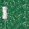 Christmas wrapping paper roll with mistletoe design on green background. 5 metres x 50 cm