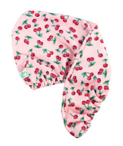A pink hair turban covered with a red and green cherry pattern.