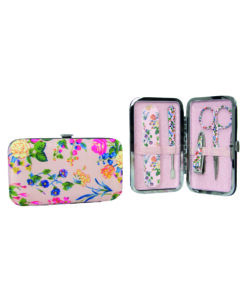 A pink satin manicure purse with colourful floral pattern. Inside the purse is a nail file, nail clippers, scissors and a cuticle pusher.