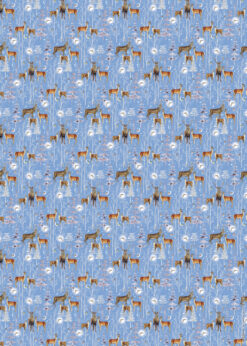 Blue Christmas wrapping paper with deer, snowy trees, and moonlit woodland scene.