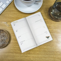 Image of the diary open in situ on a table