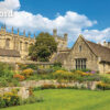 Front cover of this 2026 Calendar of Oxford featuring stone buildings and vibrant gardens, beneath a bright blue sky with scattered clouds.