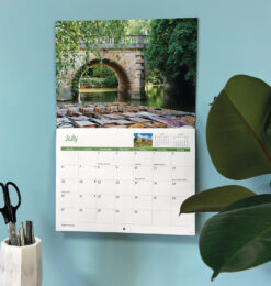 Image showing the calendar in situ hanging on a wall.