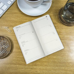 Image of the diary open in situ on a table.
