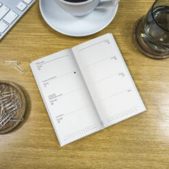 Image of the diary open in situ on a table.