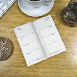 Image of the diary open in situ on a table.